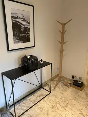 a black table in a room with a picture of a car at Cosy Louvrex -Liège Francorchamps in Liège