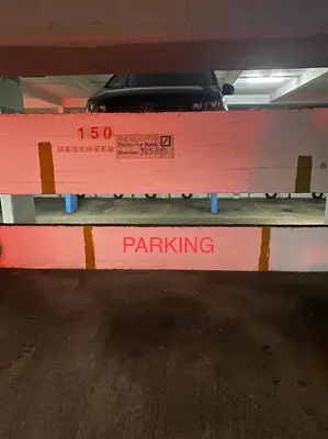a parking bench in a parking garage with a car on it at L’émeraude in Liège