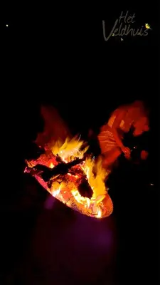 a person is jumping over a fire on a skateboard at Het Veldhuis in As